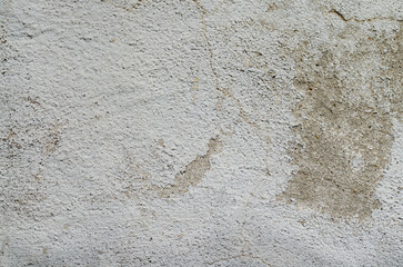 grey cement wall texture with cracks and spots