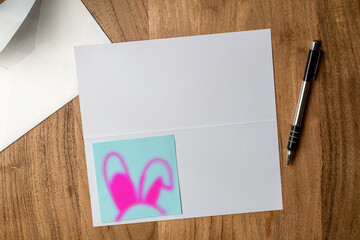 funny card for easter bunny ears, paper, envelope and pen