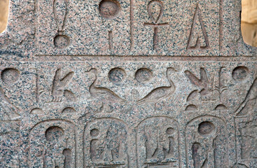 Granite stone carved with hieroglyphs, Temple of Karnak, Luxor Egypt

