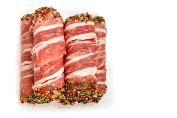 Bacon-wrapped meat roll with spices and herbs. Jamon pork, prosciutto, or presunto meat products, tartare meat inside. Meatloaf close up high focus 