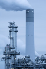 Chemical factory at dusk and smoke stack.