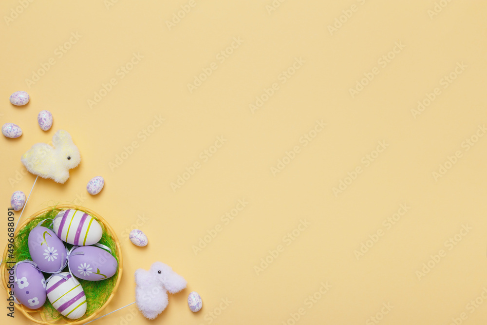 Poster easter card.eggs in a toy rabbit basket on a yellow background with copy space.