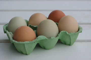 Organic raw chicken eggs in a box