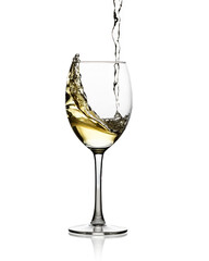 White wine pouring into a glass. White background. High Key.