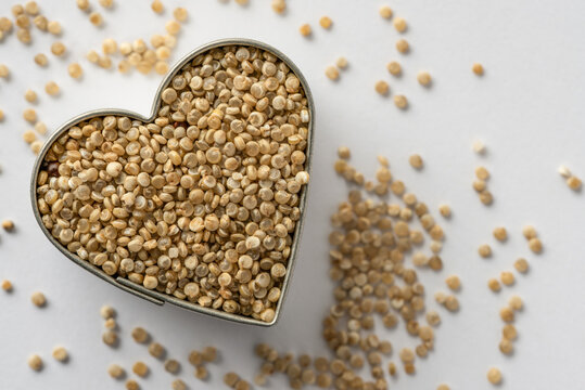 Uncooked Golden Quinoa in a Heart Shape