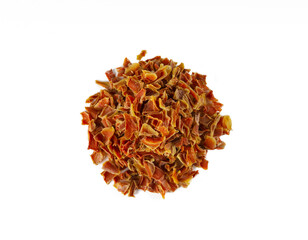  dried carrot pieces heap isolated on white background. Spices and food ingredients.