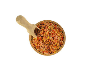  dried carrot pieces in wooden bowl and scoop isolated on white background. Spices and food ingredients.