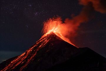 Fuego Volcano in Guatemala erupting at night. View from Acatenango. - obrazy, fototapety, plakaty
