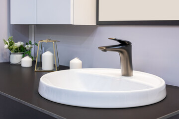 Bathroom interior with sink and faucet.