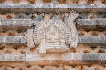 Mayan stone carving on the wall of the Nunnery Quadrangle, Uxmal archaeological site, Yucatan,...