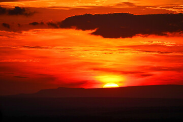 Fototapeta na wymiar Sunset in the mountains. Golden hour. Sunrise. Orange. Clouds.
