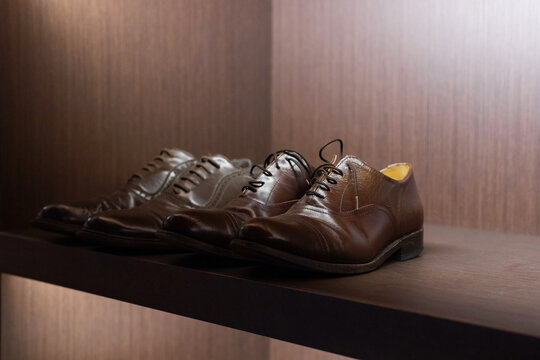 Men's Leather Shoes On Brown In A Shoe Shelf. Shoe Close-up.