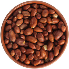 Roasted peanuts in a brown ceramic bowl. Isolated close-up photo of food close up from above on white background.
