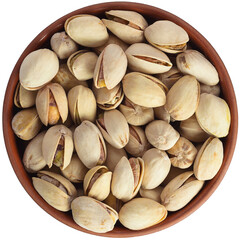 Roasted pistachios in a brown ceramic bowl. Isolated close-up photo of food close up from above on white background.