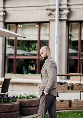 serious businessman standing in city