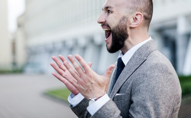 man wearing suit excited for success
