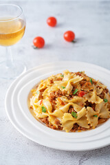 Minced beef tomato sauce pasta in a white plate
