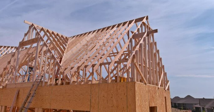 New building under construction frame stick built post wooden beam with aerial top view