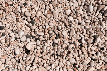 background of pebble stones on the beach