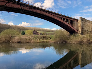 Fototapeta na wymiar Metal bridge over the river