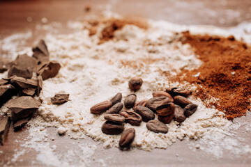 Baking background with ingredients for cake on wood with flour and cocoa