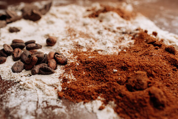 Baking background with ingredients for cake on wood with flour and cocoa