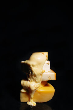 Melted cheese on black background