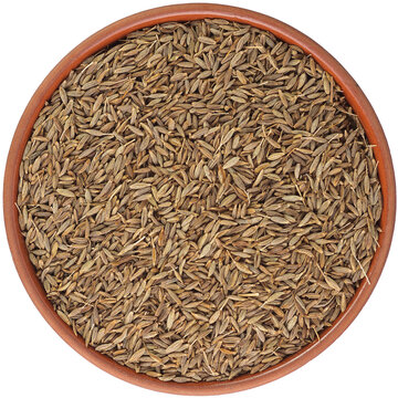 Zira in a brown ceramic bowl isolated on white background. Isolated close-up photo of food close up from above on white background.