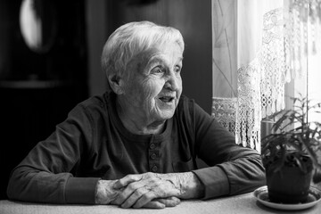 Portrait of old woman. Black and white photo.