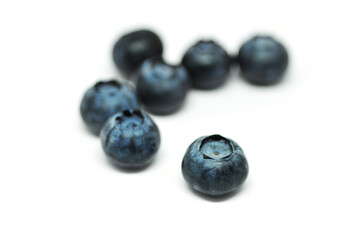 Blueberries on a white background. Signs. Healthy wholesome food. Vitamins and microelements.
