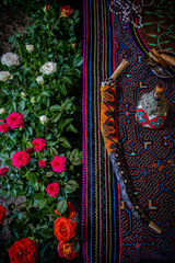 Sao Paulo, SP, Brazil - April 26 2022: Altar for ceremony with flowers, shipibo fabric, kuripes for snuff application details