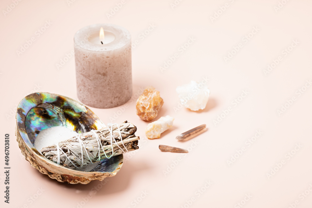 Wall mural smudge kit with white sage, palo santo, abalone sea shell. natural elements for cleansing environmen