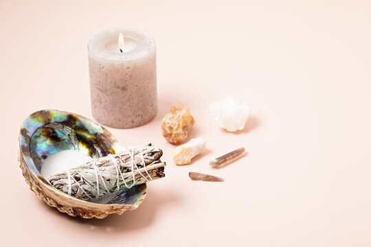 Smudge kit with white sage, palo santo, abalone sea shell. Natural elements for cleansing environment from negative energy, adding positive vibes. Spriritual practices, witchcraft concept
