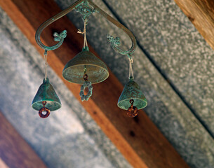Small hanging verdigris brass South Asian temple bells 