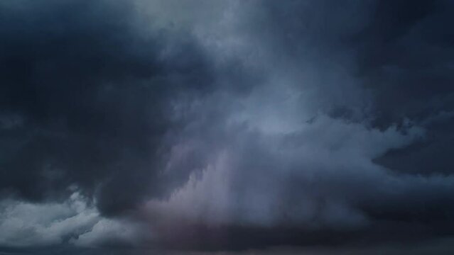 Lot of lightning during a thunderstorm. Storm clouds are moving fast on the viewer, timelapse 4k