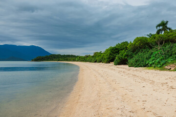 Beautiful beach, mountains on a cloudy day in Florianopolis, Brazil