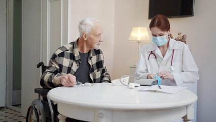 The doctor comes to the pensioner's home and starts the examination