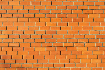 Obraz premium Wall is made of red brick. Stonework. Texture of wall.