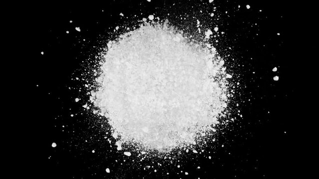 Super slow motion of rotating white powder explosion isolated on black background at 1000fps.