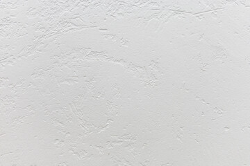 White rough texture or background. Decorative wall covering with white plaster. Rough white wall. Texture or background for design