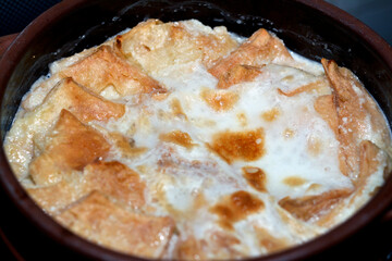 Traditional Arabic Egyptian Eastern dessert cuisine called Om Ali, Egyptian Bread Pudding in a...