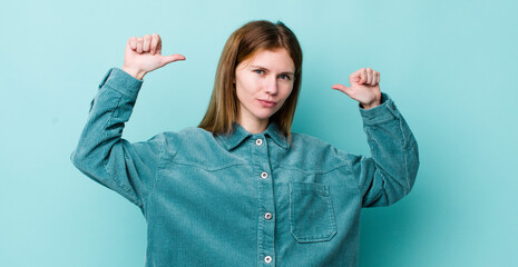 red head pretty woman feeling proud, arrogant and confident, looking satisfied and successful,...