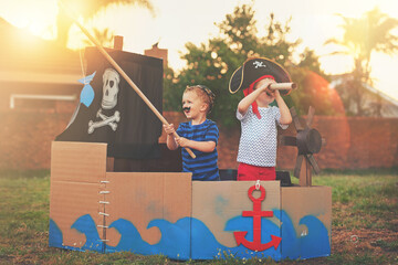 These little pirates just want to have fun. Shot of a cute little boy and his brother playing...