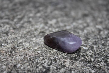 amethyst healing stone on the pavement