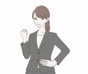 ガッツポーズをするスーツの女性