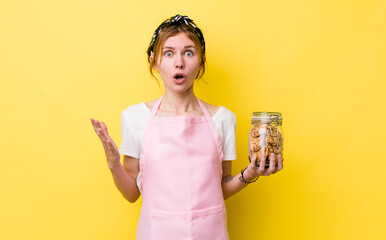 red head pretty woman amazed, shocked and astonished with an unbelievable surprise. housewife...