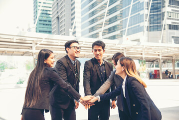 Group of diversity people fist bump holding hands together power of tag team. Teamwork Multiethnic people group working togetherness. Business people team holding hands successful. Business meeting