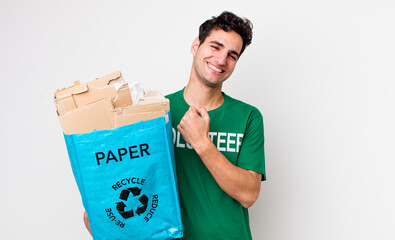 handsome hispanic man feeling happy and facing a challenge or celebrating. ecology concept