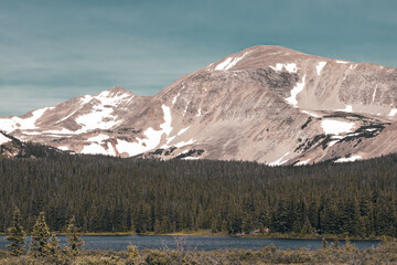 snow covered mountains in the summer