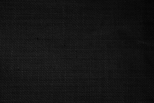 Black Hemp rope texture background. Haircloth wale black dark cloth wallpaper. Rustic sackcloth canvas fabric texture in natural. © siripak